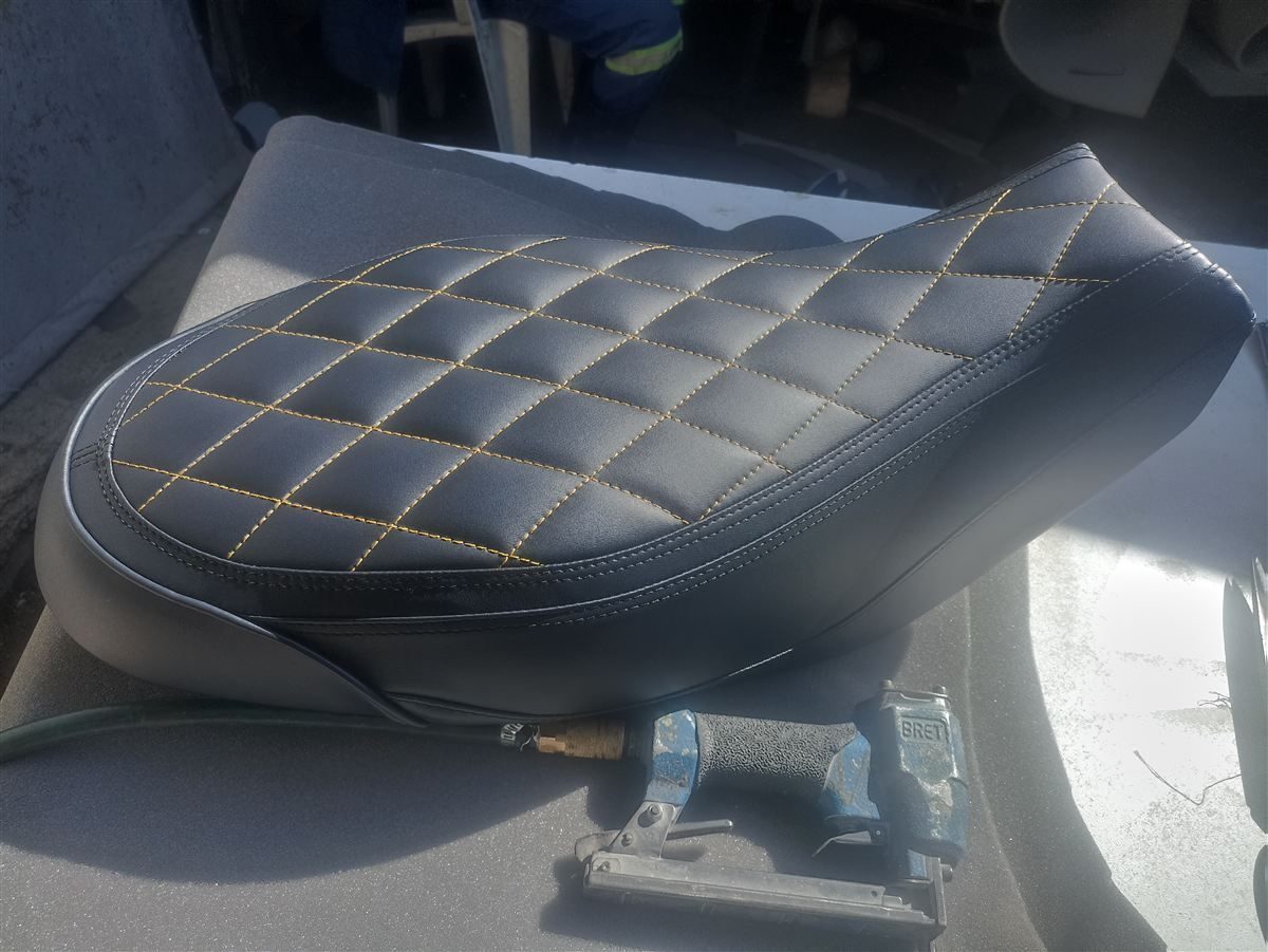 Custom upholstered Ducati seat with diamond stitching
